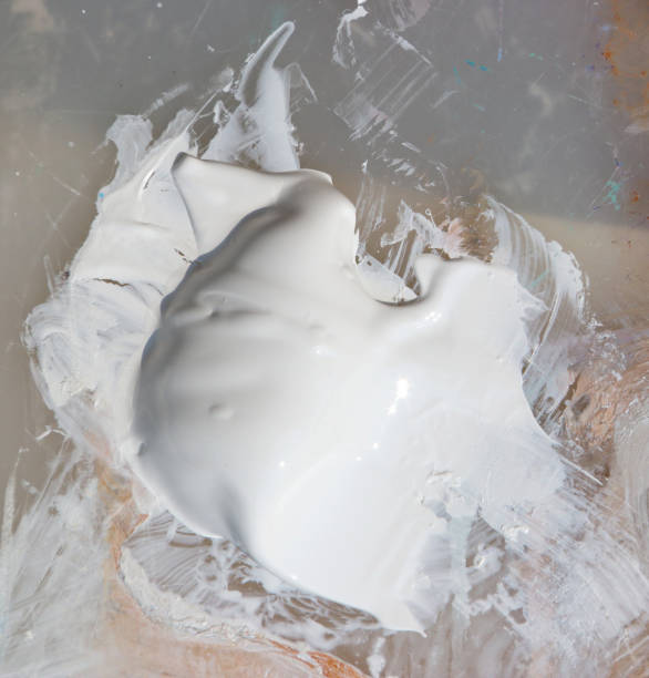 istock White pigment acrylic colors on palette. 700769204