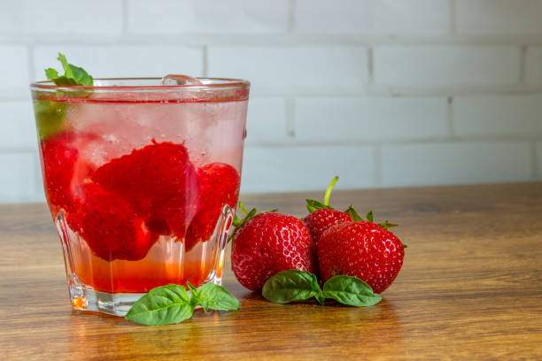 istock Strawberry iced drink in a wooden table 700781834