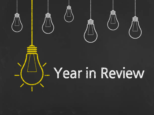 Year in Review - Business Chalkboard Background stock photo