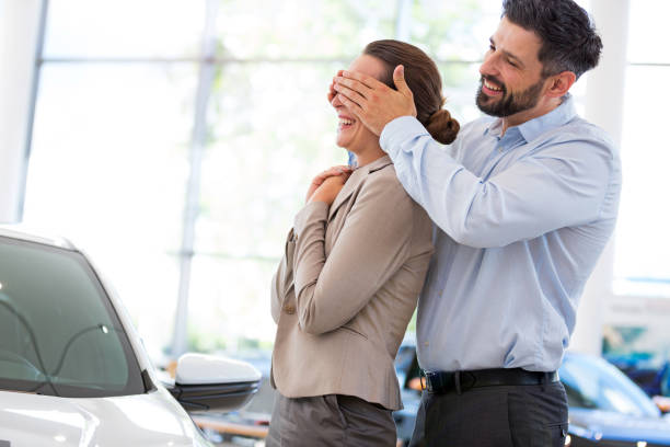 istock Young couple buying a car 700783112