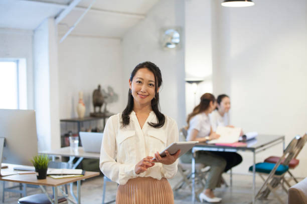 istock Women smile at the Office 700787422
