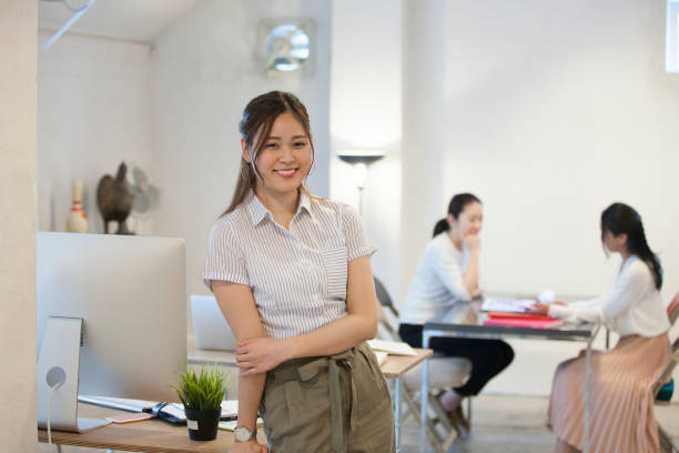 istock Women smile at the Office 700787436