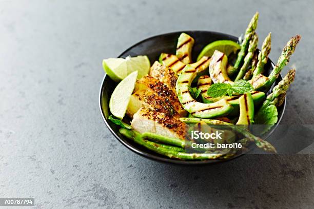 Grilled Chicken Salad With Grilled Avocado And Asparagus Stock Photo - Download Image Now