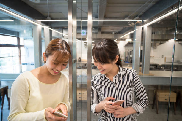 istock Women who speak smart phone 700788090