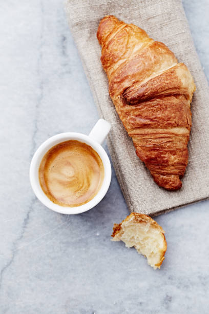 Cup of Espresso with Croissant stock photo