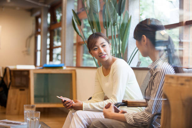 istock Women who speak smart phone 700789332