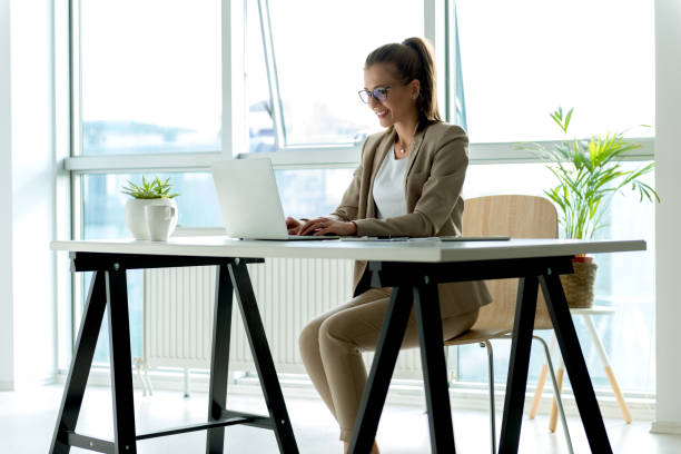 istock Businesswoman typing on laptop 700793688