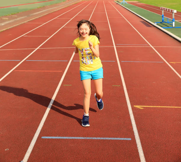 istock Disabled girl have fun on the stadium 700804120