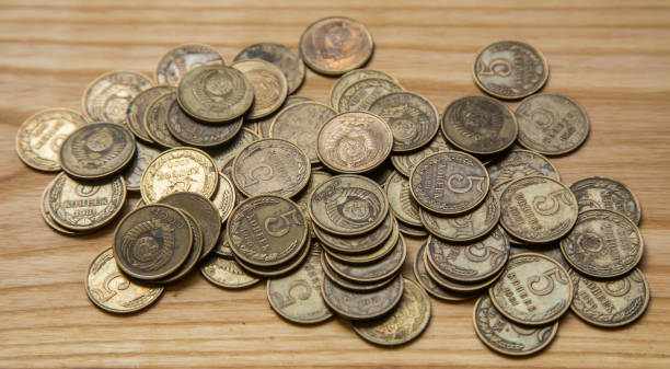 istock Old soviet couns on a wooden background. Hisoric, used currency. 700806162