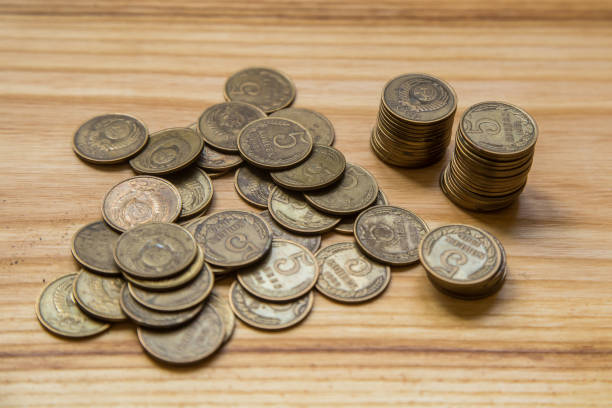 istock Old soviet couns on a wooden background. Hisoric, used currency. 700806368