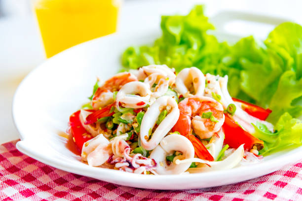 Spicy shrimp, squid and vermicelli salad, glass noodle spicy salad Thai call Yum Woon Sen - the delicious Thai food