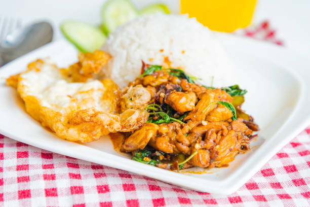 istock Stir-fried pork and basil leaves served with rice and fried egg 700810190