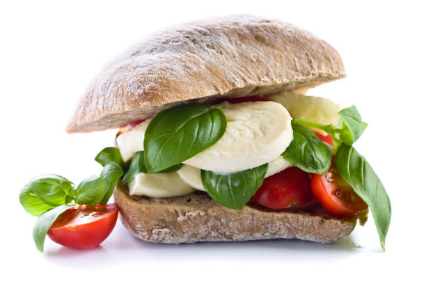 Ciabatta with mozzarella, tomato and basil isolated on white