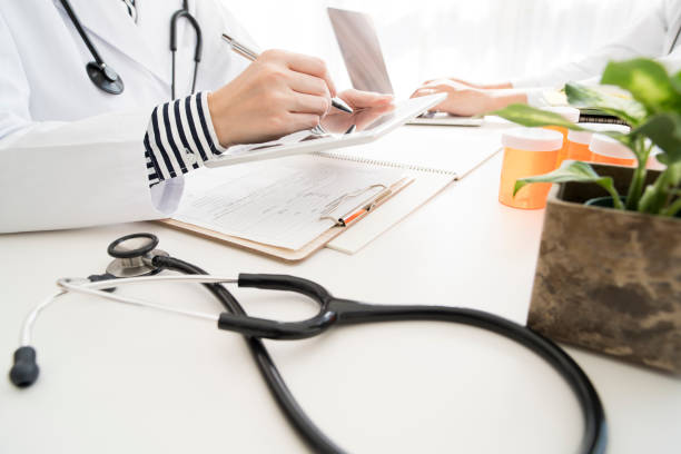 istock Men and women in white coats to work 700814290