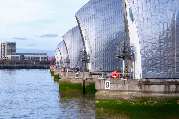 istock Thames Barrier with a waterfront apartment in the background 700817520