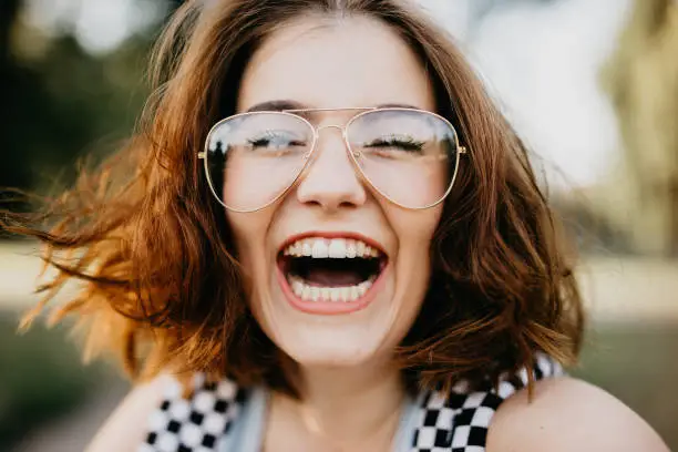 Photo of Happy girl smiling at the camera