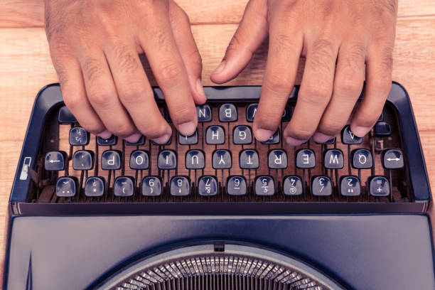 istock Cropped image of businessman typing on typewriter 700828640