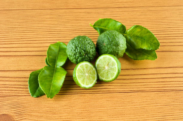 istock Kaffir Lime or Bergamot over wooden background 700834590