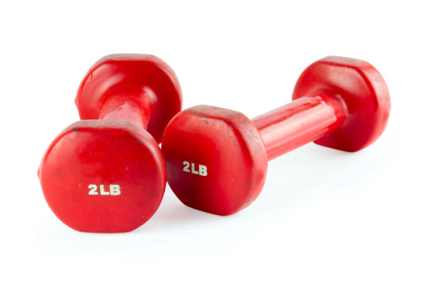 istock Two of red dumbbells, isolated on white background 700834640