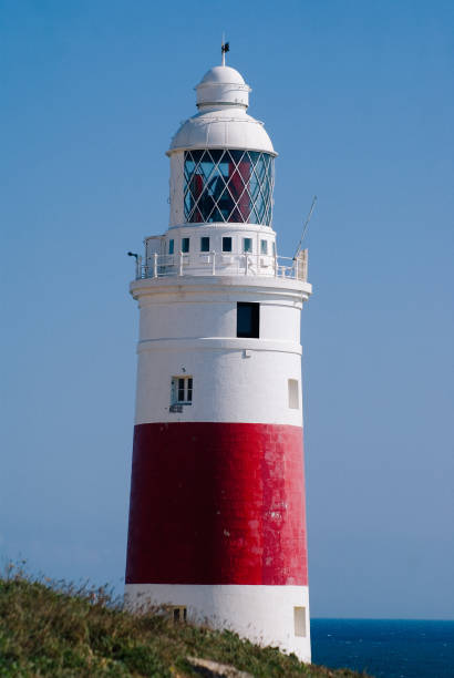 istock Lighthouse By Sea Against Clear Sky 700837731