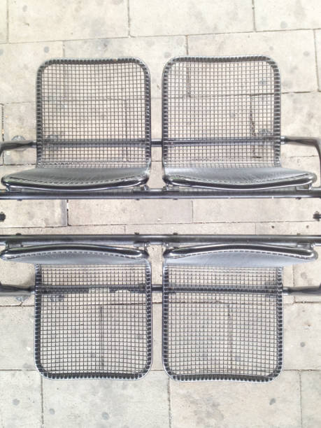 istock Directly Above Shot Of Empty Metallic Chairs On Walkway 700838423