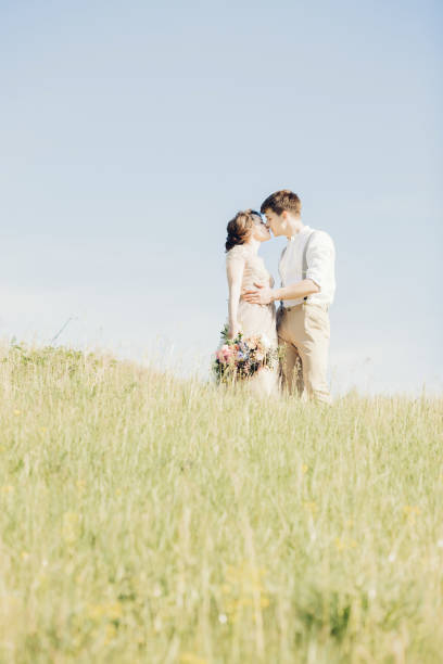istock wedding couple on  nature.  bride and groom hugging at  wedding. 700840564