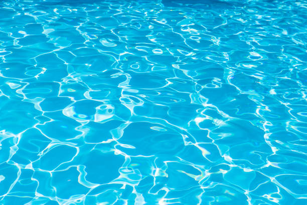 istock Beautiful ripple wave and blue water surface in swimming pool 700840796