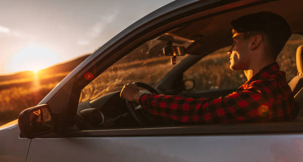 istock Portrait of young man in car 700847744