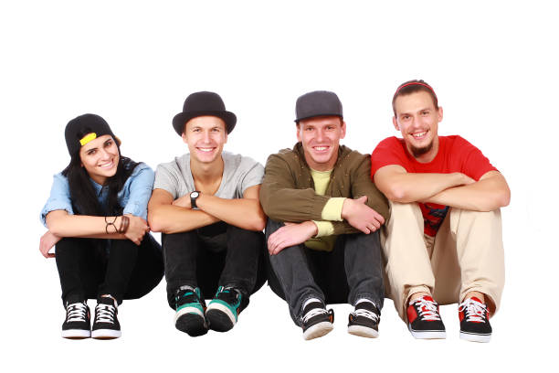 Group of friends sitting on white stock photo