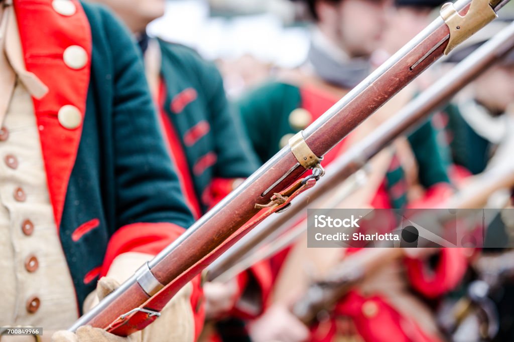 Building musketeers with guns. Focus on the gun Building musketeers with guns. Focus on gun Napoleon Bonaparte Stock Photo