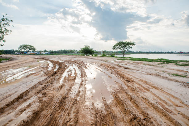 mud and dirt road at the country side - mud dirt road road dirt imagens e fotografias de stock