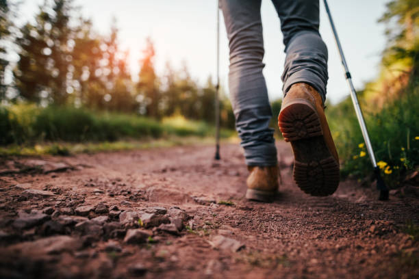 Hiker walks on Mountain Trail