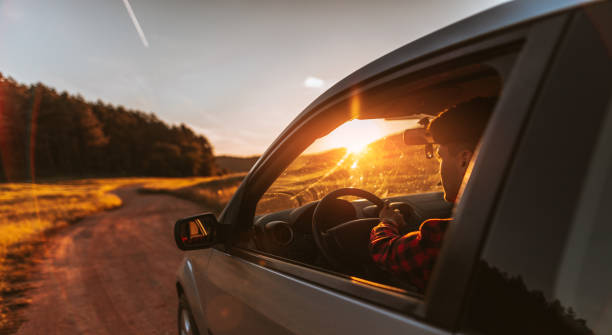 istock Portrait of young man in car 700862484