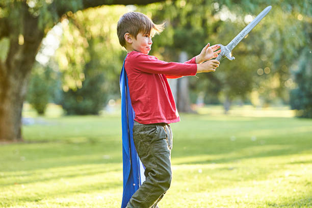 istock Young boy playing in Autumn leaves 700865124