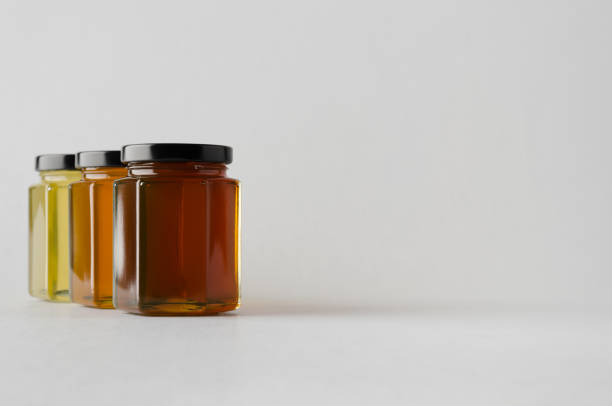istock Honey Jar Mock-Up - Three Jars 700877250