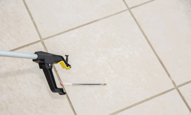 istock Patient or disabled person using a grabber / reacher 700896410