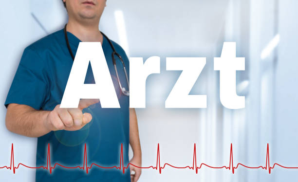 istock Arzt (in german doctor) shows on viewer with heart rate concept 700901950