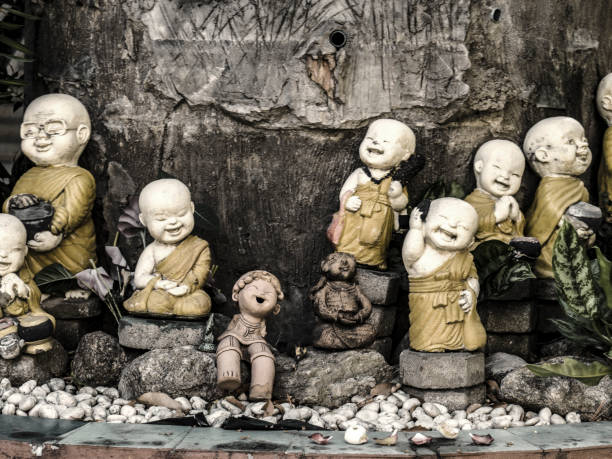 istock Laughing monk statues at  Wat Loi Khro Chiang Mai Thailand 700906258