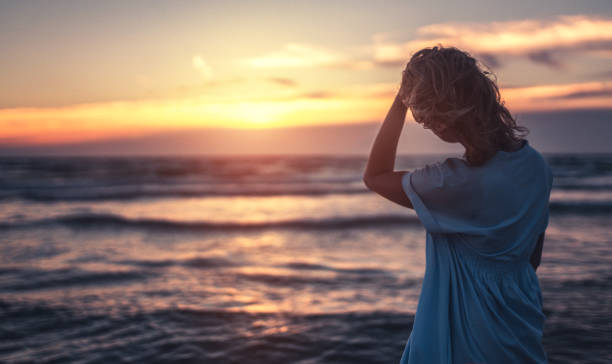 istock Watching beautiful sunset near sea 700917722