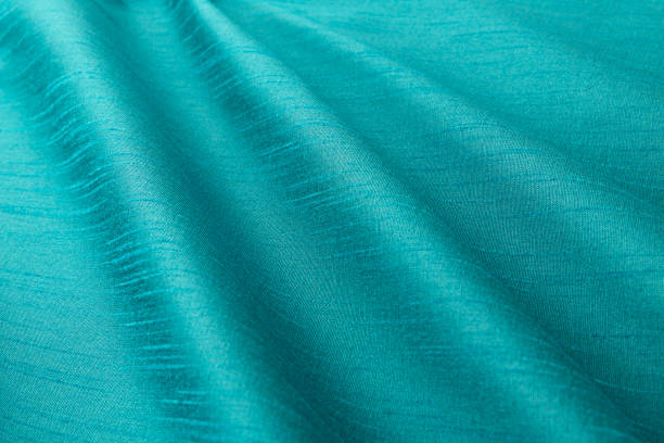 fondo turquesa lujo paño o pliegues ondulados de textura seda de grunge satén - rayon fotografías e imágenes de stock