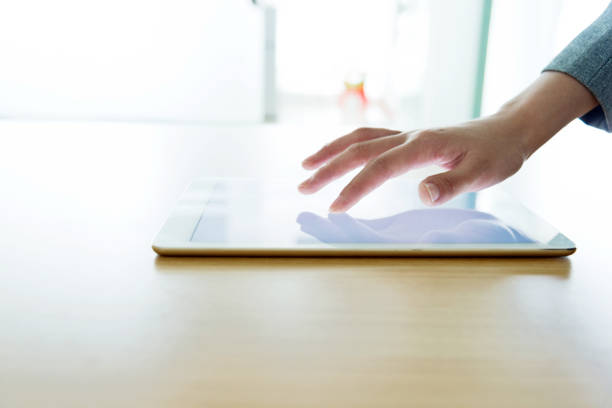 istock Woman hand toching digital tablet 700931722