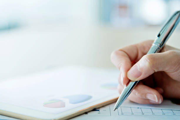 istock Businesswoman writing on the desk 700932346