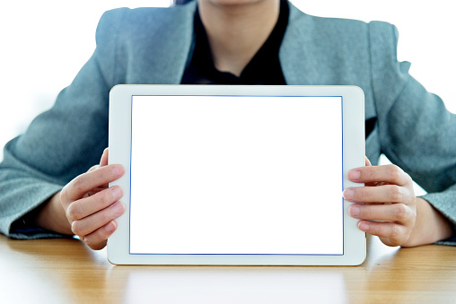 Woman hand holdin a digital tablet with empty screen