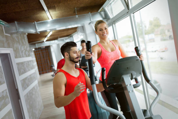 istock Attractive woman working cardio exercises with trainer 700948166