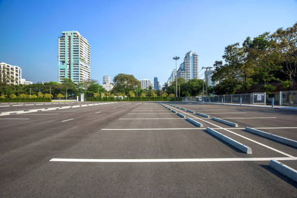 istock Empty parking lot at city center 700959204