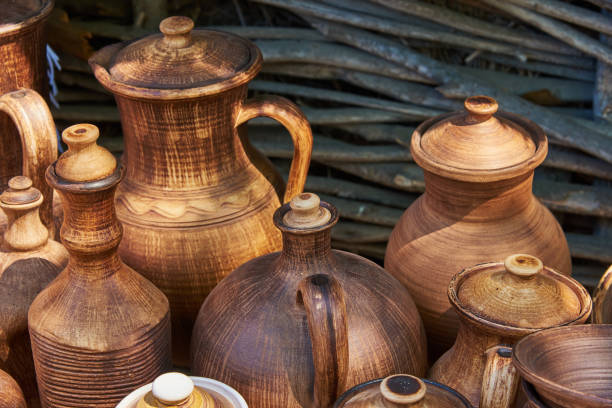 istock Monochrome ceramic handmade bottles and jugs under natural sunlight 700961296