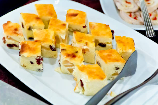 Horizontal photo of cottage cheese dishes in restaurant with spoon