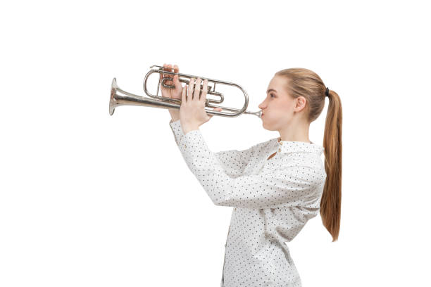 istock Blond woman with trumpet, isolated 701013648