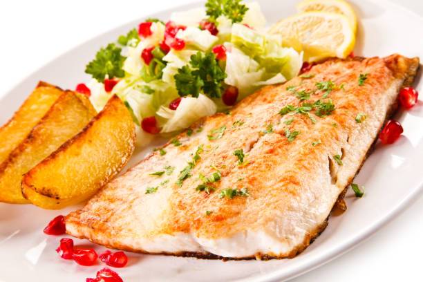 istock Fish dish - fish fillet and vegetables 701017134