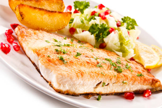istock Fish dish - fish fillet and vegetables 701017260